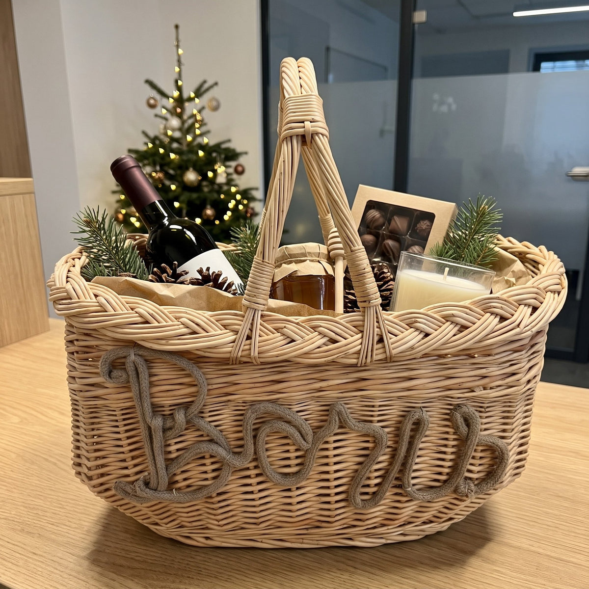 Personalised willow gift basket with the name Boris in rope lettering, filled with wine, honey and chocolates