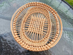 Oval openwork willow tray with a lattice centre and open rings of upright rods, top view